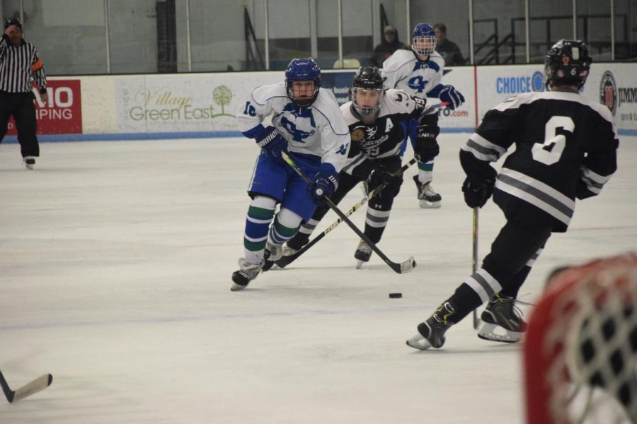 Jake Schaffner handles the puck in traffic for the Bluebirds. His goal in OT won the game.