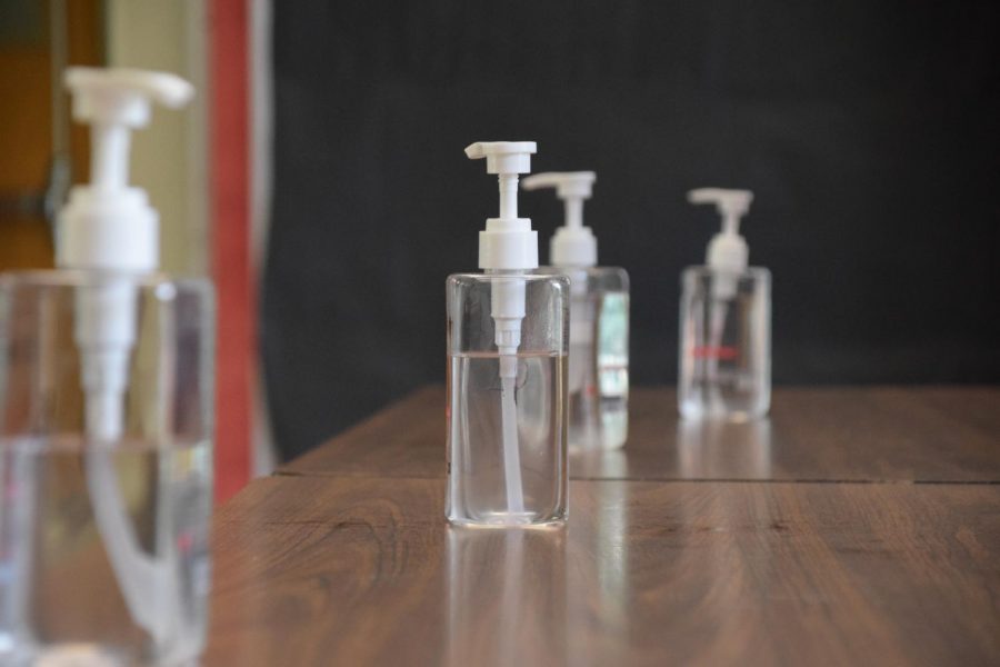 Bottles of hand sanitizer stand on tables in hallways throughout Craig.