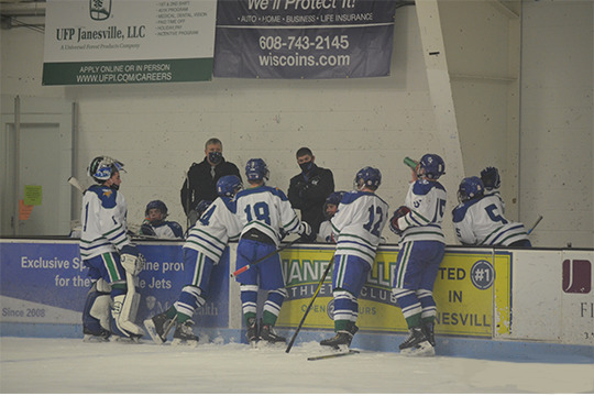 The Bluebirds huddle around the Bench during a Timeout called in the 3rd Period