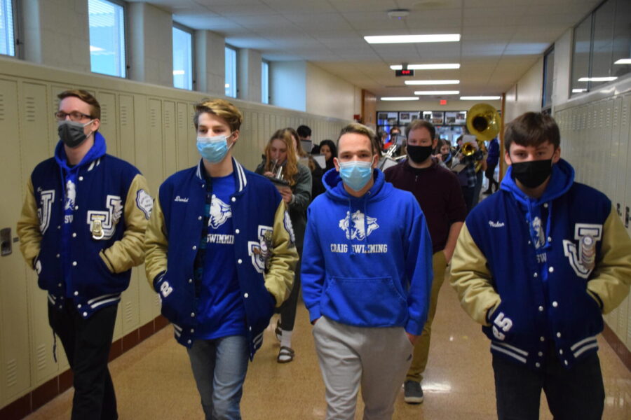 Craigs state-bound swimmers take their walk to state during advisory period on Wednesday, Feb. 16. From left to right: -from left to right are junior Ben Witt, senior David Cummings, and freshmen Jameson Punzel and Nolan Schoof.