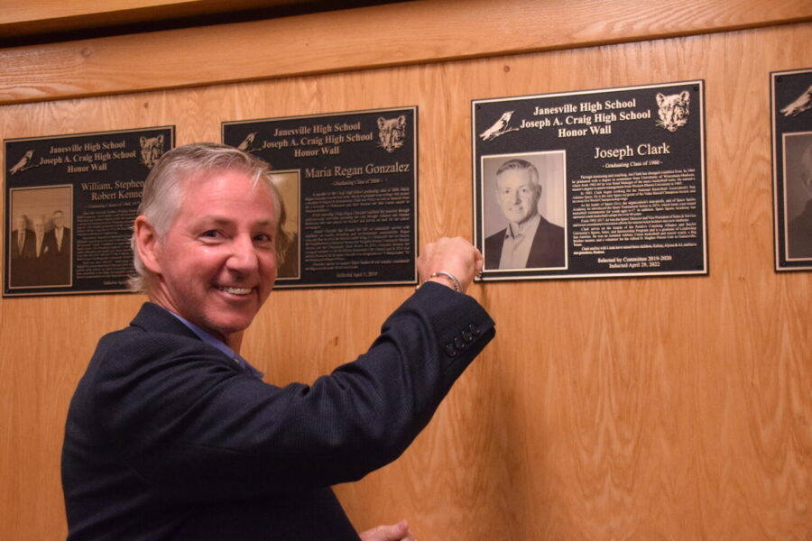 Joe Clark hanging his plaque on the Honor Wall