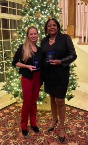 Janesville’s Teacher of the Year, Stefanie Hanson, and Staff Member of the Year, Stephanie Gates, pose with their awards. They were honored at a dinner at the Janesville Country Club on Tuesday, Dec. 6. 