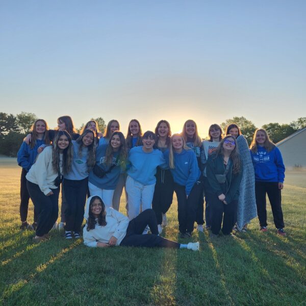 Seniors pose in front of first surise of the year. 